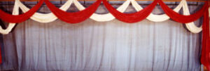 Red and White Ribbon Festoon Backdrop